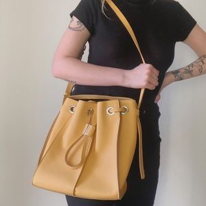 Mustard yellow & silver drawstring bag
